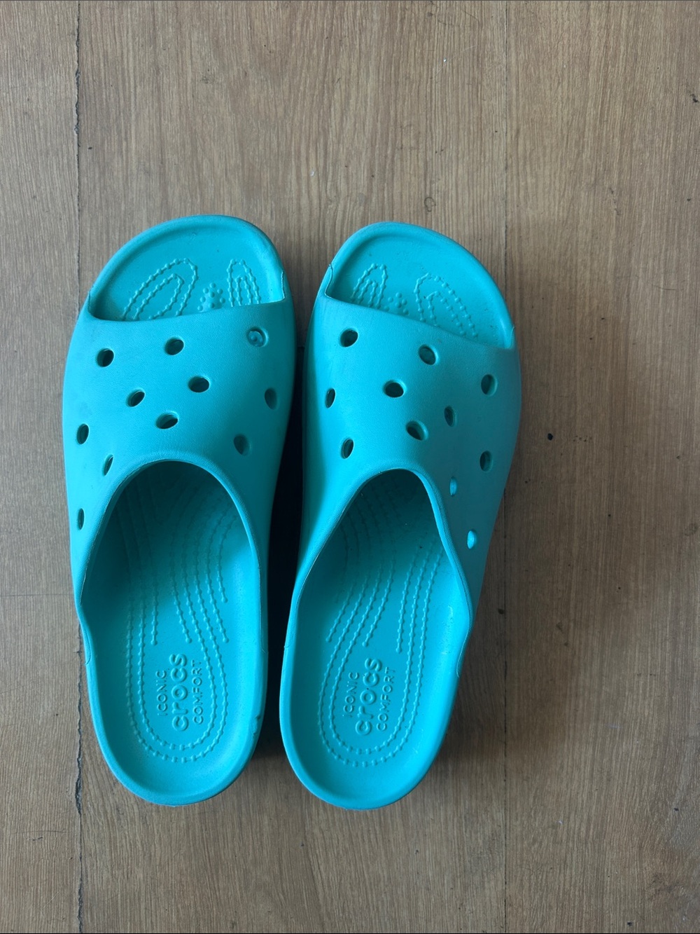 Crocs flip flop sandals in mint green color